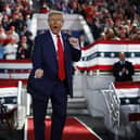 RALEIGH, NORTH CAROLINA - NOVEMBER 04: Republican presidential nominee, former President Donald Trump dances off stage at the conclusion of a campaign rally at the J.S. Dorton Arena on November 04, 2024 in Raleigh, North Carolina. With one day left before the general election, Trump is campaigning for re-election in the battleground states of North Carolina, Pennsylvania and Michigan. (Photo by Chip Somodevilla/Getty Images)