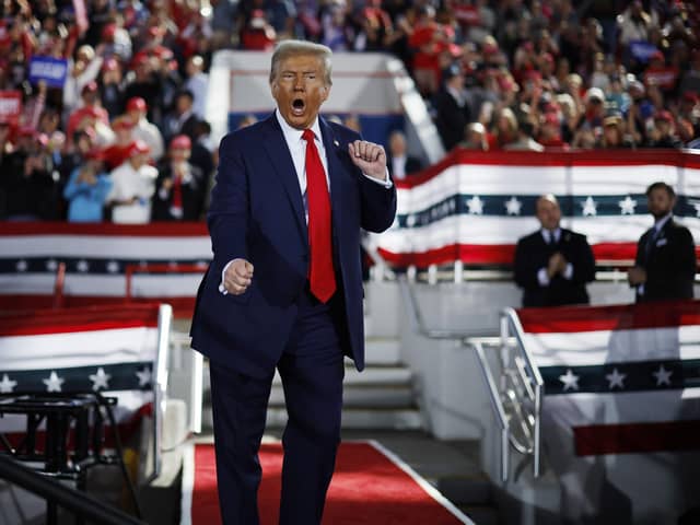 RALEIGH, NORTH CAROLINA - NOVEMBER 04: Republican presidential nominee, former President Donald Trump dances off stage at the conclusion of a campaign rally at the J.S. Dorton Arena on November 04, 2024 in Raleigh, North Carolina. With one day left before the general election, Trump is campaigning for re-election in the battleground states of North Carolina, Pennsylvania and Michigan. (Photo by Chip Somodevilla/Getty Images)
