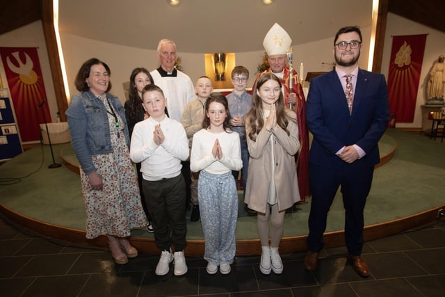 Pupils from Saint Columba's Primary School, Newbuildings, who received the Sacrament of Confirmation from Bishop Donal McKeown at Sacred Heart Church, Waterside on Friday last. Included in photo are Fr. Michael Canny, Vicar General, Mrs. Callan, Principal and Mr. O'Neill, P7 teacher. (Photo: Jim McCafferty Photography)