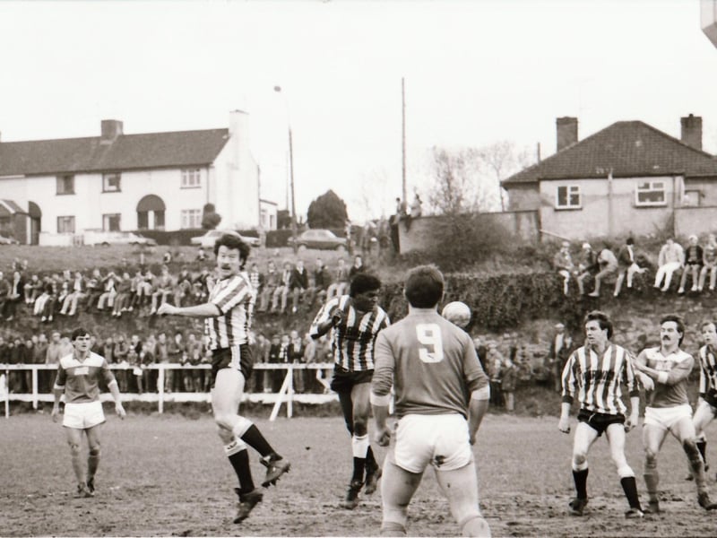 Derry City in action as fans watch on.