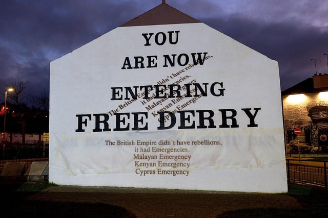 One of the projected images, on Free Derry Corner on Thursday evening, of the British colonial past from the ‘The Sun Never Set And The Blood Never Dries’ art project created by Art Everywhere.  The event was part of Bloody Sunday 51 anniversary. Photo: George Sweeney. DER2305GS – 105