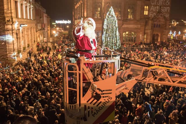 Santa arrives over a crowd of thousands from Derry's Walls in 2018. Picture Martin McKeown. Inpresspics.com. 22.11.18