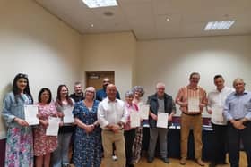 Students being presented with their certificates on completion of their level three British Sign Language course.