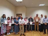 Students being presented with their certificates on completion of their level three British Sign Language course.
