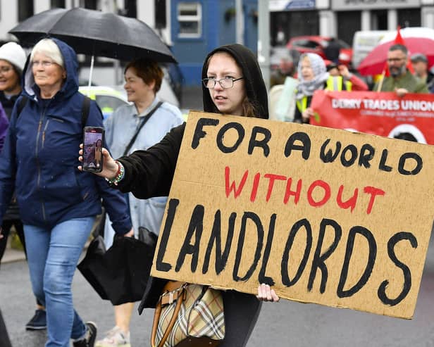 Participants carry placards during the Derry Housing Action Committee protest march over housing crisis on Saturday afternoon Photo: George Sweeney