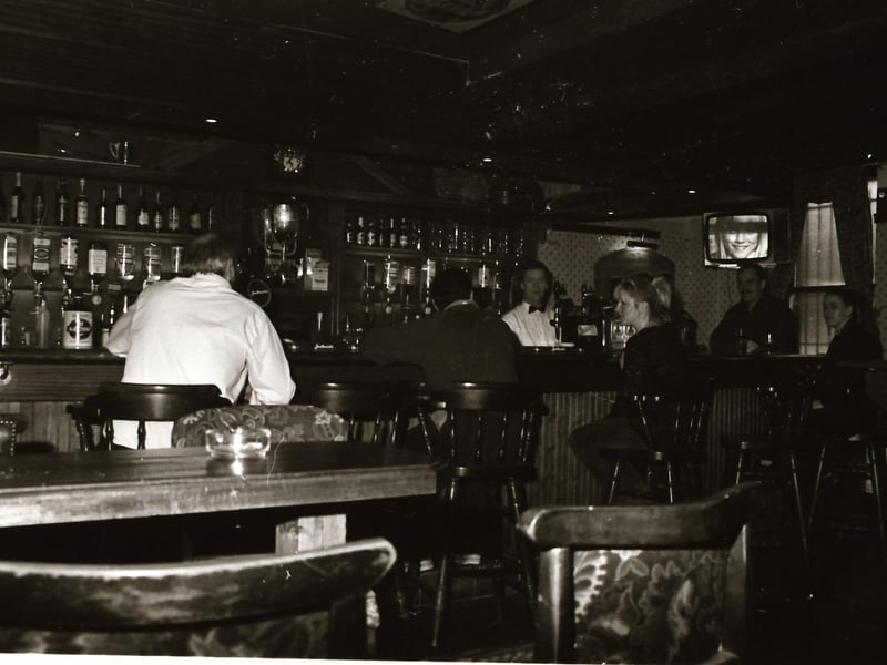 Customers and staff at Doherty's bar beside Castle Gate in Derry city centre.