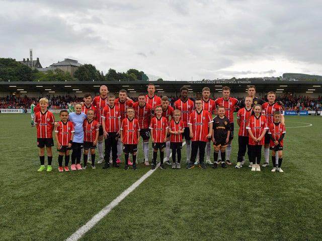 Mascots pictured with the Derry City starting eleven against Cork City. Photograph: George Sweeney. DER2325GS – 96
