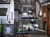 Forensic officer attends the scene of a suspicious death of a woman in Harvey Street. Photo: George Sweeney