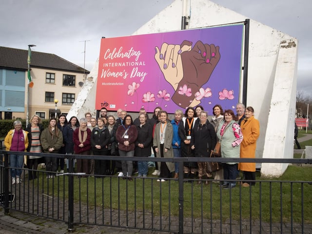 INTERNATIONAL WOMEN'S DAY. . . . .Group pictured on Tuesday at the launch of the International Women's Day banner at Free Derry Corner. The launch culminated in a number of events throughout the city over the week. (Photos: Jim McCafferty Photography)