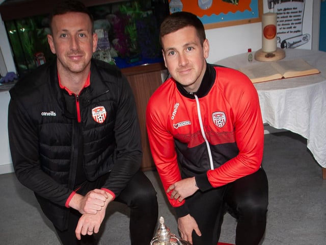 Former Steelstown PS pupils, Shane and Patrick McEleney, bring the FAI Cup to the school this week. (Photo: Jim McCafferty)