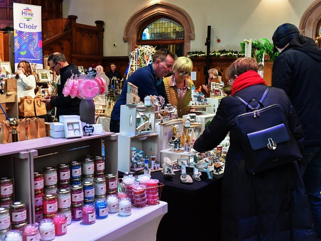 People browse the large range of gifts at the Guildhall Christmas Fair on Friday afternoon. Photo: George Sweeney / Derry Journal