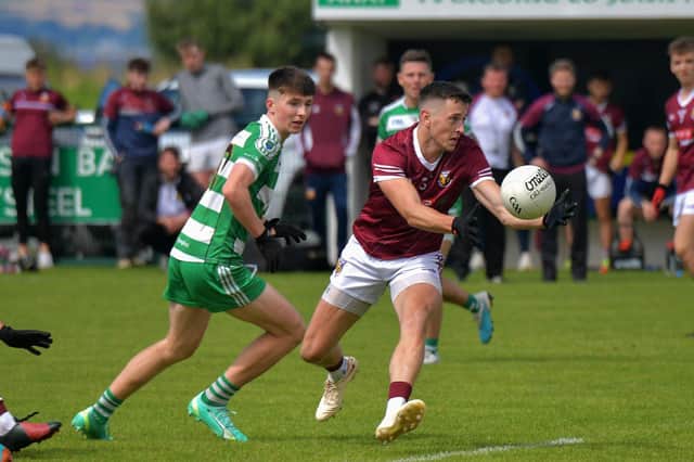 Banagher’s Gabriel Farren gets the ball ahead of Faughanvale’s Shay Martin. Photo: George Sweeney. DER2331GS – 79