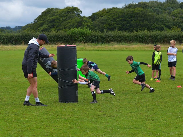 For boys and girls from P1 to P7, the Mini Rugby Club will run for five weeks, Monday to Thursday, from 9:00 am to 2:00 pm. The first week begins on June 30th, and the last week is Monday, August 4th. The club costs £60 per child per week, with a discounted rate of £50 per week for a second child from the same family. Photo: George Sweeney. DER2331GS – 58