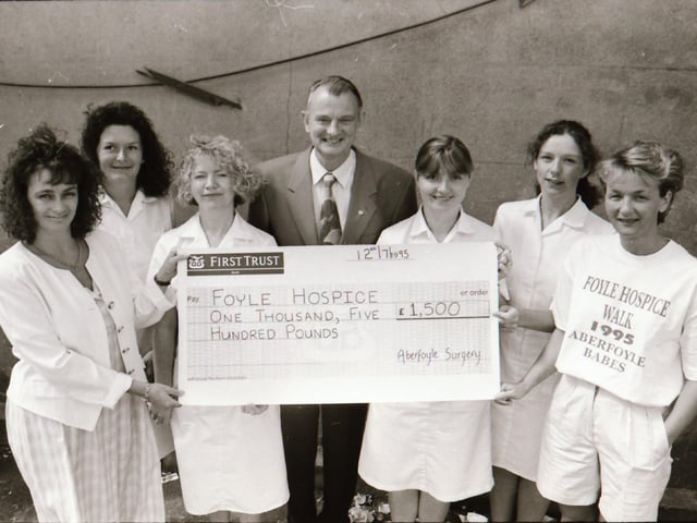 Aberfoyle Surgery staff present a cheque to Dr Tom McGinley of the Foyle Hospice.