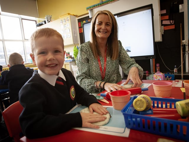 P1 pupil Mason getting in some baking practice with the help of Mrs. McCartney.