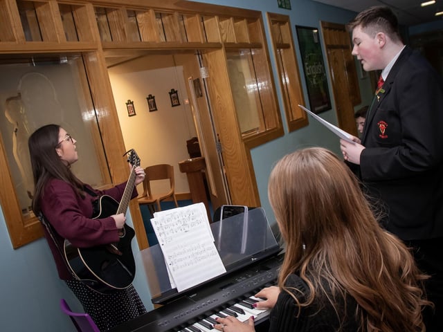 Mrs. Emma Barnaby and Mrs. Serena Doherty performing at St. Joseph's Boys School Grandparents To School Mass on Wednesday. : .