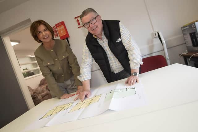 Looking over the final plans for the work at Dove House are Jayne Quigg, manager, Dove House and project manager Bernard Crumlish, also a former manager at JP Corry's.