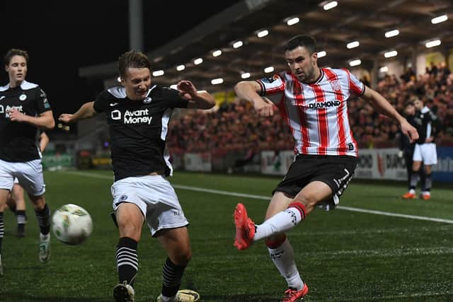 Sligo Rovers’ John Ross Wilson tackles Derry City’s Michael Duffy. Photograph: George Sweeney