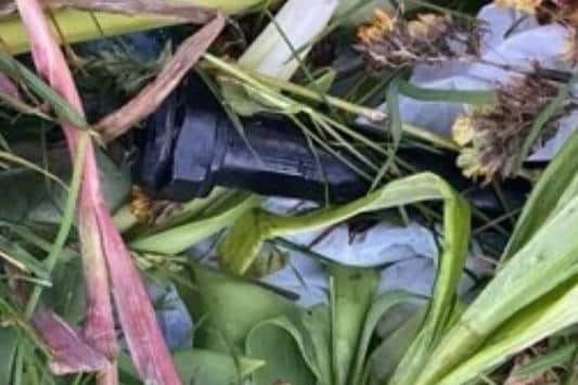 One of the pipe bombs discovered in the cemetery.