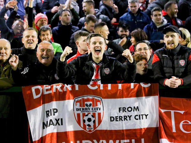These delighted Derry City fans spot our camerman at Dalymount.