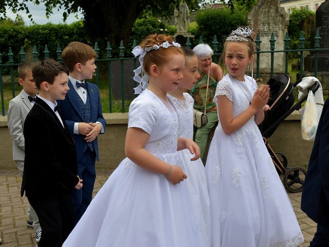 Children from schools in the Long Tower parish, who made their First Holy Communion recently, take part in the Solemnity of Corpus Christi procession, in the ground of the church, on Sunday afternoon. Photo: George Sweeney. DER2324GS –