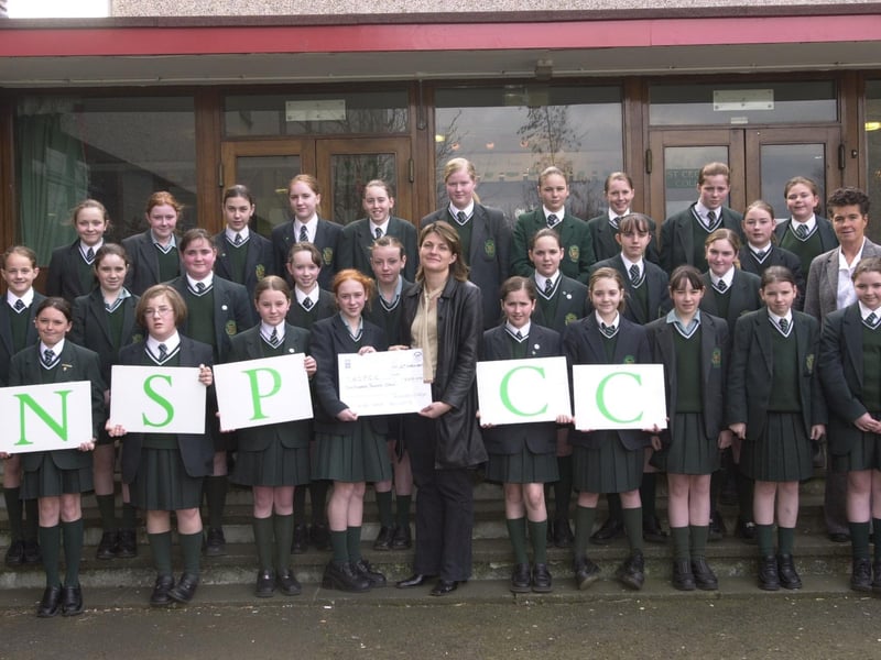 Pupils from St Cecilia's College present the NSPCC with a cheque for £600, the money they raised by holding a sponsored quiz and safety talks at the school. Included are Ann Marie McSorley, centre, NSPCC schools organiser, and Roisin Lynch, vice-principal.