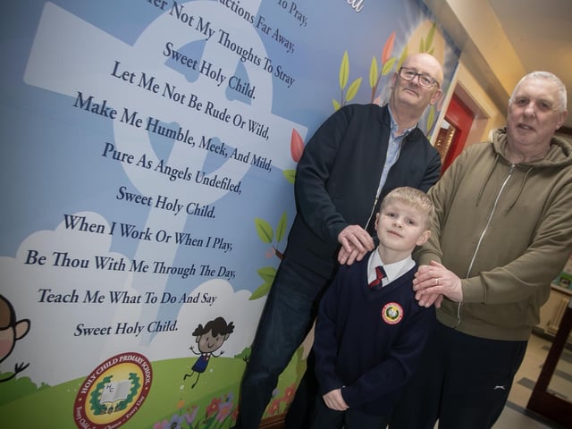 One of the very proud young pupils at Holy Child PS pictured on 'Grandparents To School' Day on Wednesday with his two grandads. (Photos: Jim McCafferty Photography) : .