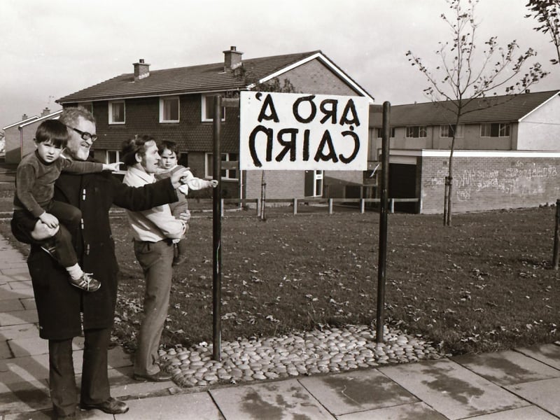 A new sign featuring the name of Carnhill in Irish.