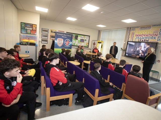 Mrs. Ciara Deane, Principal, St. Joseph's Boys School pictured with Daniel Harrison, Director of Operations, Steven Gerrard Academy explaining this year's programme to students at the school on Thursday last. (Photos: Jim McCafferty Photography)