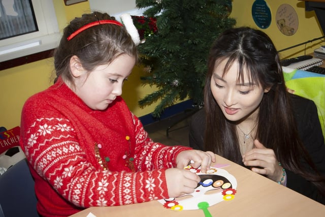 Steelstown PS pupil Olivia making traditional Chinese masks in class.