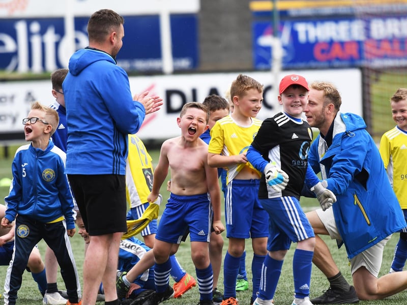 The Moyola Park Under-8's celebrate their O'Neills Foyle Cup triumph at The Brandywell. (Photo: Keith Moore)