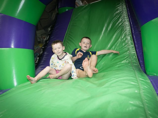 Fun and games for these two lads at the Feile '25s Party in the Park (Big Bog BBQ) in Pilot's Row on Saturday. (Photos: Jim McCafferty Photography) : .