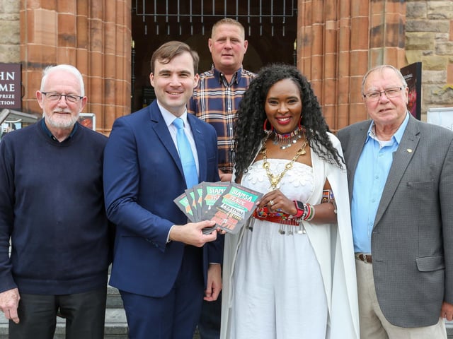 he Mayor of Derry City and Strabane District Council, Councillor Lilian Barr welcomes Brendan Cassidy, committee member, Siamsa Sraide Street & Arts Festival Swinford, Co. Mayo, at a reception in the Guildhall. Mr. Cassidy was visiting the City as guest of the Hamilton Flute Band who have a long association with the Swinford Festival which celebrates its 40th anniversary this year. Included from left are Robert McGonigle, Stephen Williamson, chairman, and Billy Cairns, Hamilton Flute Band.