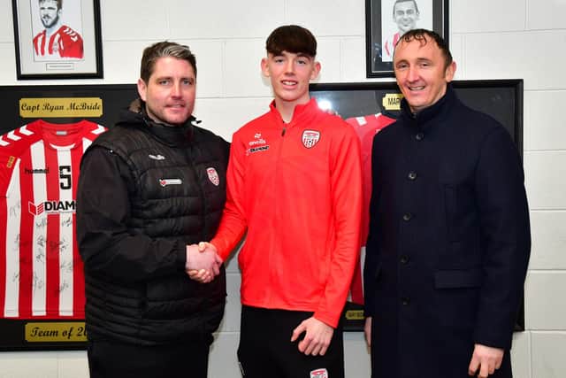 Luke O'Donnell pictured with his dad Olly and Derry boss Ruaidhri Higgins.