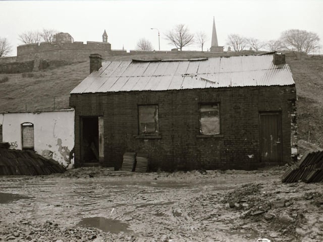 One of the last remaining older dwellings in the Bogside beneath the shadow of Derry's Walls.