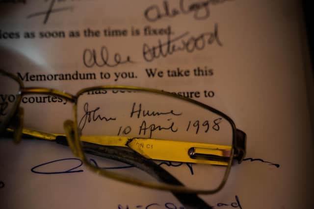 John Hume's glasses and a signed copy of the Good Friday Agreement.