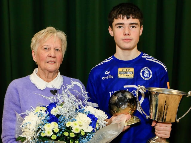 Collette Ballard who presented the Ronnie Ballard Award for the Overall Player of the Year to John Anthony Deane at Trojans annual presentation of awards held in Cecilia's College. (Photo - Tom Heaney, nwpresspics)