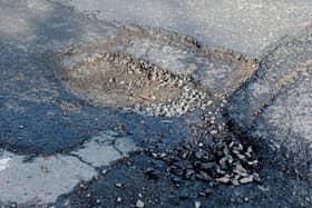 An image of the huge pothole on the Northland Road