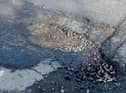 An image of the huge pothole on the Northland Road