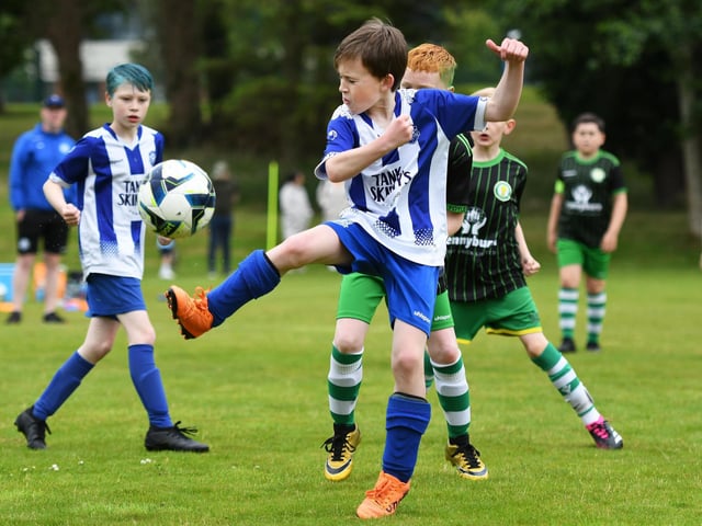 Flynn Lynch wins the ball for Culmore Colts under-10's during their match against Top Of The Hill Celtic Colts. (Photo: Keith Moore)