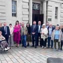 Mr John McDevitt with relatives and others as he attended a hearing earlier this year.