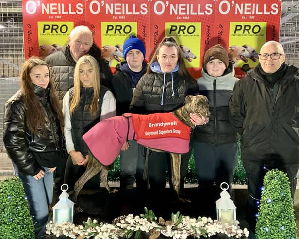 Ardnasool Luna who won the second race, the Brandywell Greyhound Supporters Group Sprint, in 17.11 with (from left) Chelsea Doyle, Matthew Talbot, Lauren McClay, Rian Ceallach & Shane Talbot & Patsy Doyle.