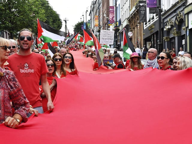 The ‘Turn Shipquay Street Red for Gaza’ march makes its way down Shipquay Street on Saturday afternoon. Photo: George Sweeney