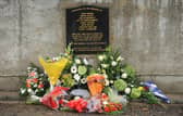 Flowers left at the memorial in Greysteel in Co Derry on the 20th Anniversary of the shooting 10 years ago. Pic Colm Lenaghan/Pacemaker
