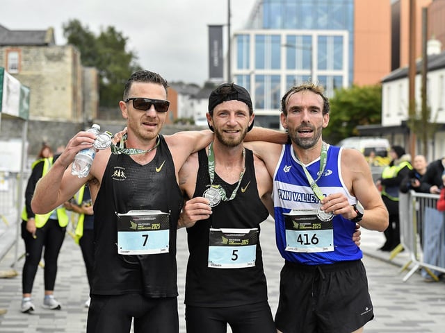 Danny Mooney, Letterkenny AC, second place, Stephen McCauley, Letterkenny AC, winner and John Joe Doherty, Finn Valley AC, third placed, pictured at the finish of the 2025 Waterside Half Marathon. Photo: George Sweeney