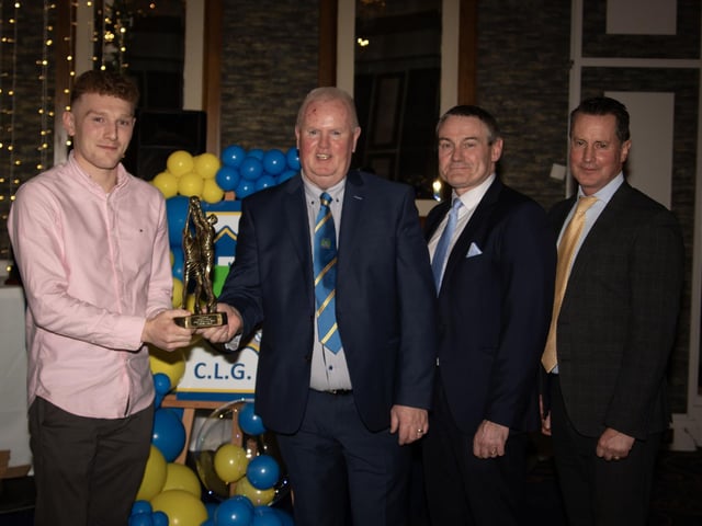 Keith McColgan, Senior Football Player of the Year 2024, receives his trophy from Liam Gallagher, Club Chair. Included from right are Cormac Hartnett, County Board Hurling Officer and Ciaran McLaughlin, former Ulster GAA President. (Photos: Jim McCafferty)