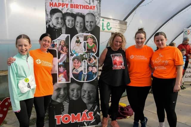 Geraldine Mullan, third from right, pictured with Lily Fitzgerald, Martina Cawley, Kaitlyn Fitzgerald and Siobhan Kilbride ahead of the Tomás memorial 5k fun walk / run held in Moville on Sunday morning. Photo: George Sweeney