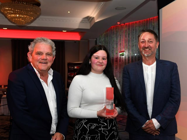 Inspirational Young Person of the Year Award winner Kaycee Deery receives her award from Steve Frazer, managing director, City of Derry Airport and compere Adrian Logan. Photo: George Sweeney