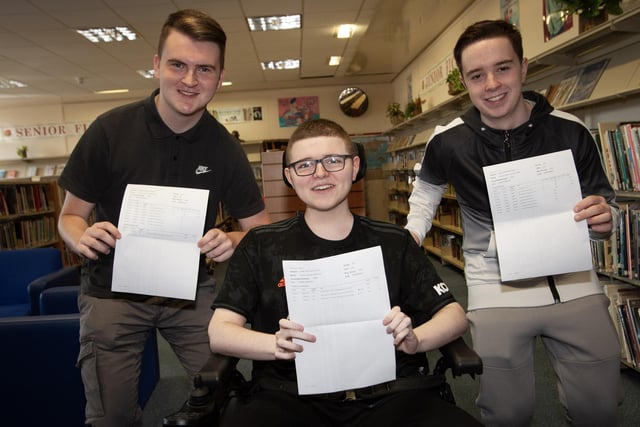 St. Joseph's A Level students Aaron McCafferty, Conor McRae and Ciaran Fisher showing off their results.