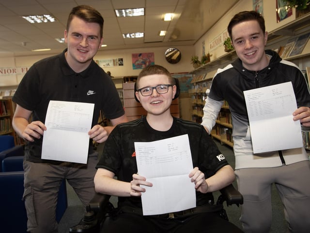 St. Joseph's A Level students Aaron McCafferty, Conor McRae and Ciaran Fisher showing off their results.